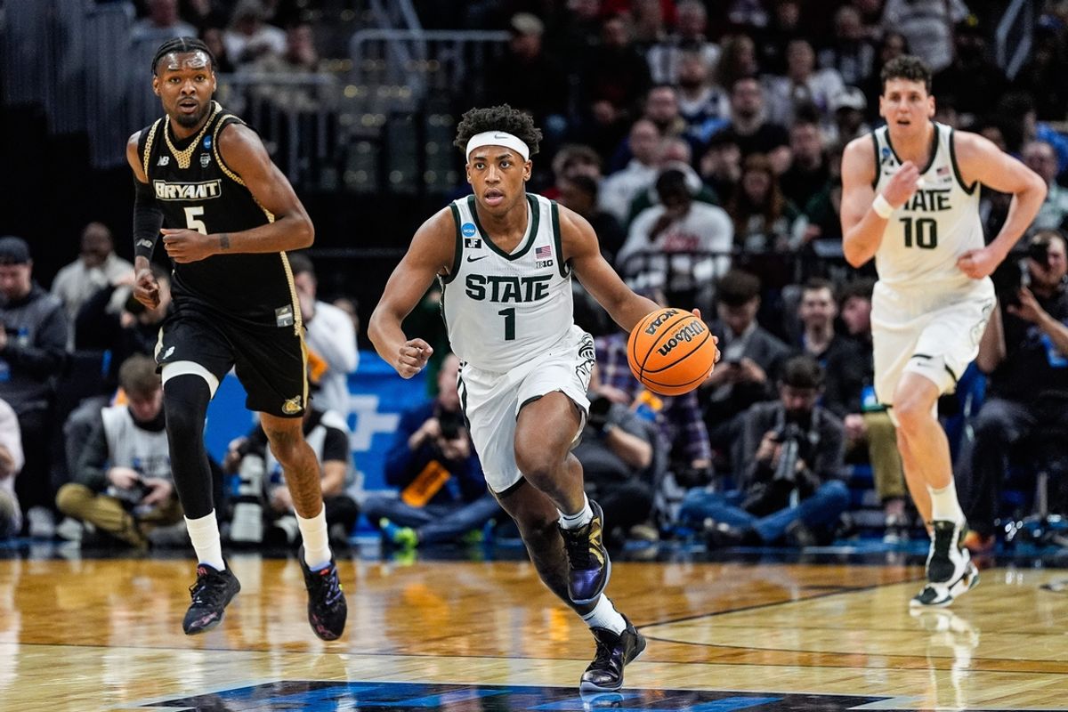 Michigan State guard Jeremy Fears Jr. (1) dribbles against Bryant forward Barry Evans (5) during the first half of the First Round of NCAA Tournament at Rocket Arena in Cleveland, Ohio on Friday, March 21, 2025.
