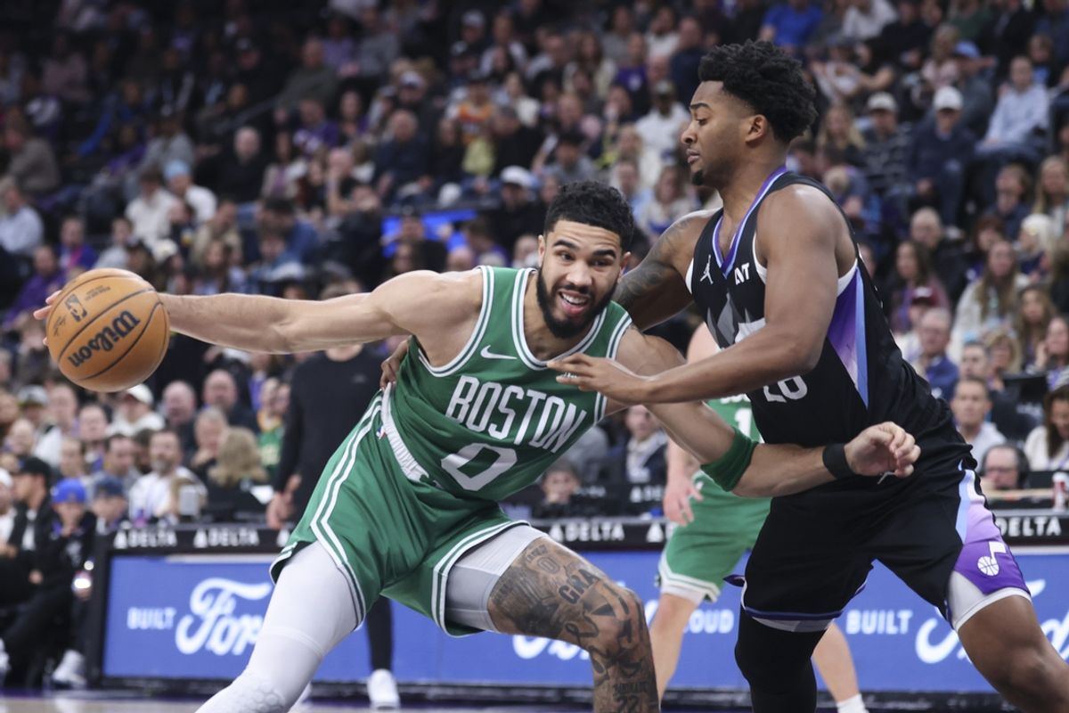 Mar 21, 2025; Salt Lake City, Utah, USA; Boston Celtics forward Jayson Tatum (0) drives against Utah Jazz forward Brice Sensabaugh (28) during the first half at Delta Center. Mandatory Credit: Rob Gray-Imagn Images
