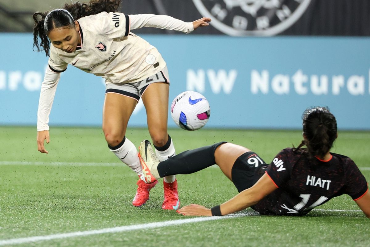 Mar 21, 2025; Portland, Oregon, USA;  Portland Thorns FC defender Sam Hiatt (16) kicks the ball away from Angel City FC forward Alyssa Thompson (21) in the first half at Providence Park. Mandatory Credit: Jaime Valdez-Imagn Images