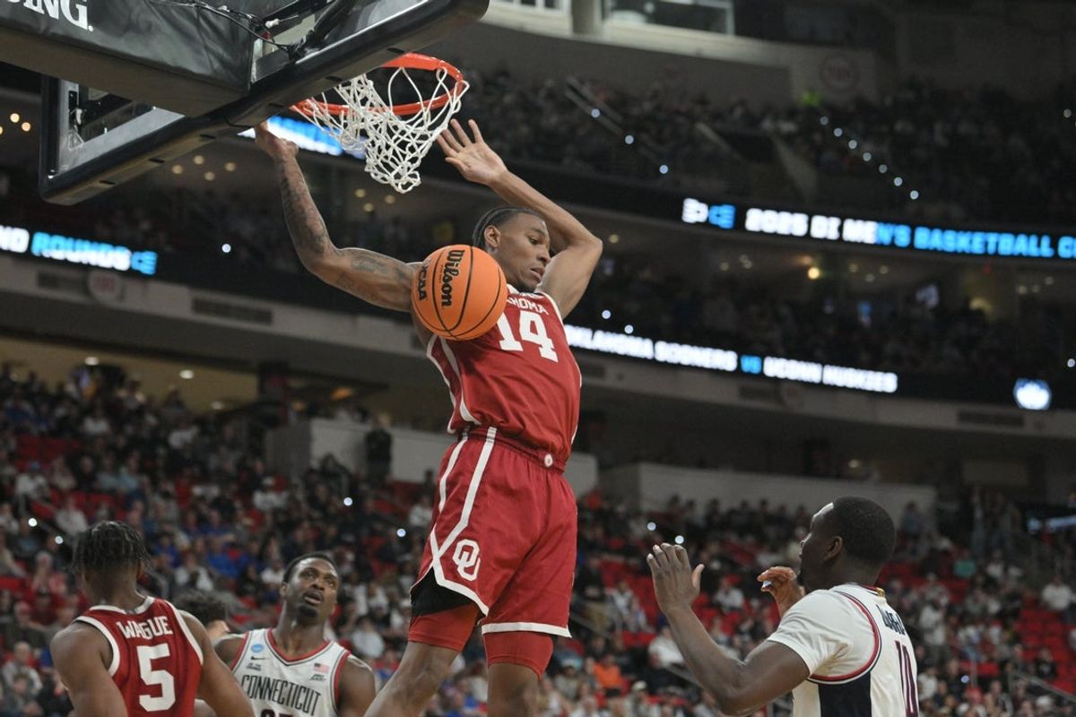 Mar 21, 2025; Raleigh, NC, USA;  Oklahoma Sooners forward Jalon Moore (14) makes a basket during the second half against the Connecticut Huskies at Lenovo Center. Mandatory Credit: Zachary Taft-Imagn Images