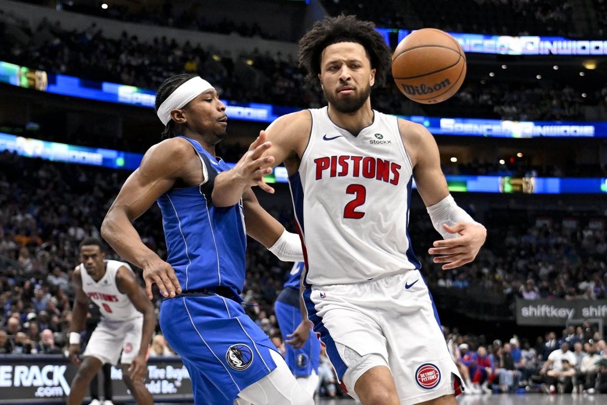 Mar 21, 2025; Dallas, Texas, USA; Dallas Mavericks guard Brandon Williams (10) knocks the ball away from Detroit Pistons guard Cade Cunningham (2) during the second half at the American Airlines Center. Mandatory Credit: Jerome Miron-Imagn Images