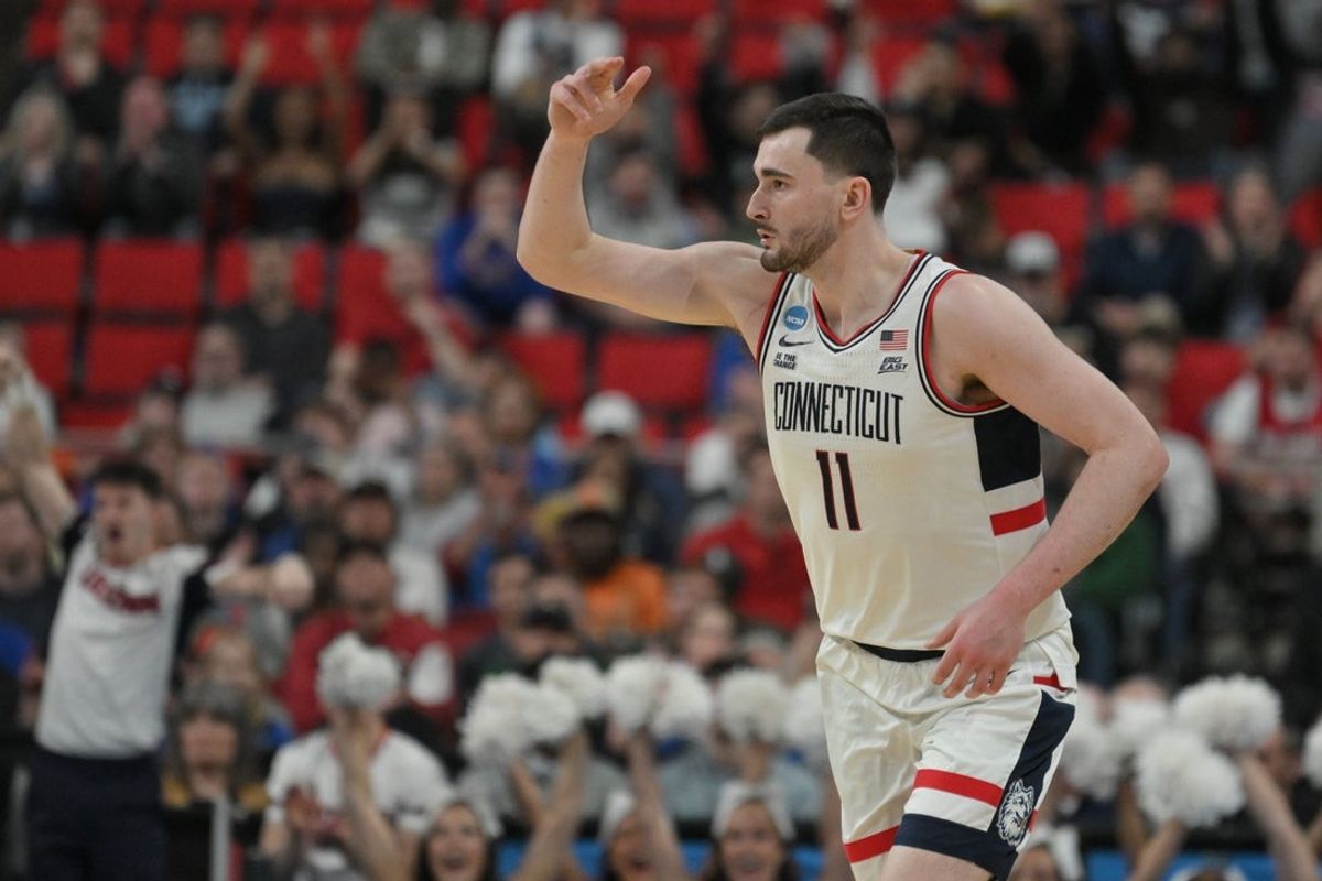 Mar 21, 2025; Raleigh, NC, USA;  Connecticut Huskies forward Alex Karaban (11) reacts during the second half against the Oklahoma Sooners at Lenovo Center. Mandatory Credit: Zachary Taft-Imagn Images
