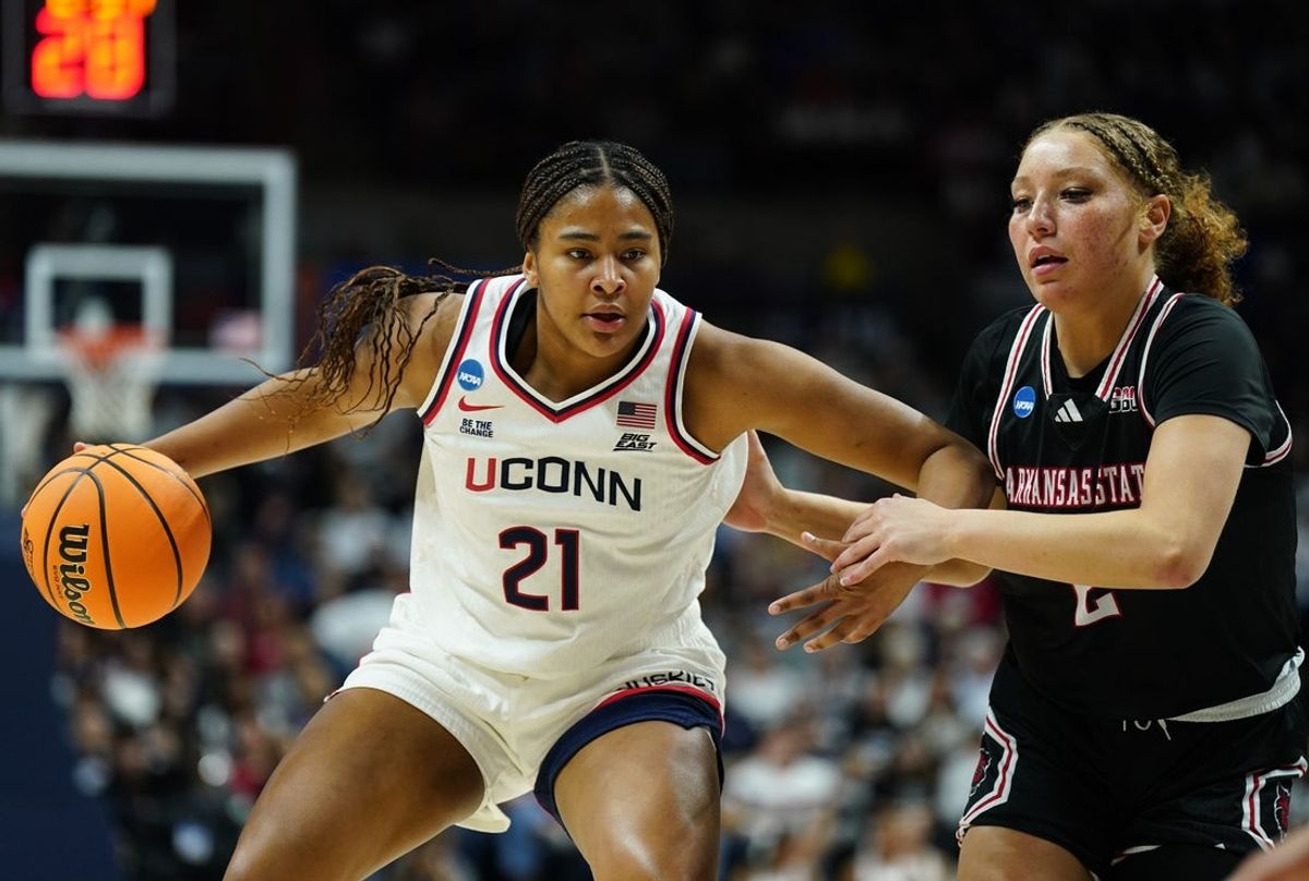Mar 22, 2025; Storrs, Connecticut, USA; UConn Huskies forward Sarah Strong (21) drives the ball against Arkansas State Red Wolves guard Wynter Rogers (2) in the first half at Harry A. Gampel Pavilion. Mandatory Credit: David Butler II-Imagn Images