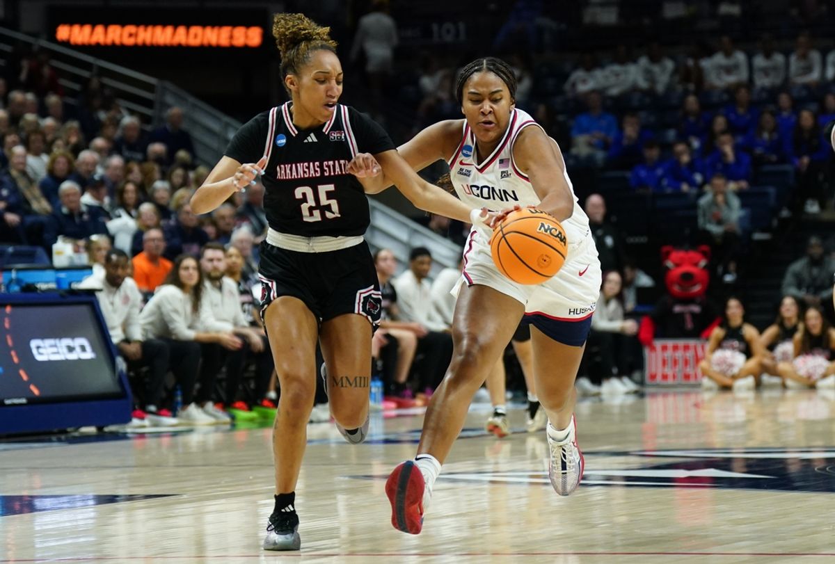 Mar 22, 2025; Storrs, Connecticut, USA; UConn Huskies forward Sarah Strong (21) works for the ball against Arkansas State Red Wolves guard Kennedie Montue (25) in the second half at Harry A. Gampel Pavilion. Mandatory Credit: David Butler II-Imagn Images