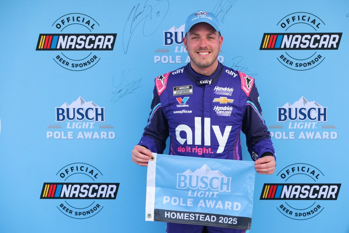 Mar 22, 2025; Homestead, Florida, USA; NASCAR Cup Series driver Alex Bowman (48) celebrates with Busch Light Pole Award after winning the pole for the the Straight Talk Wireless 400 at Homestead-Miami Speedway. Mandatory Credit: Sam Navarro-Imagn Images