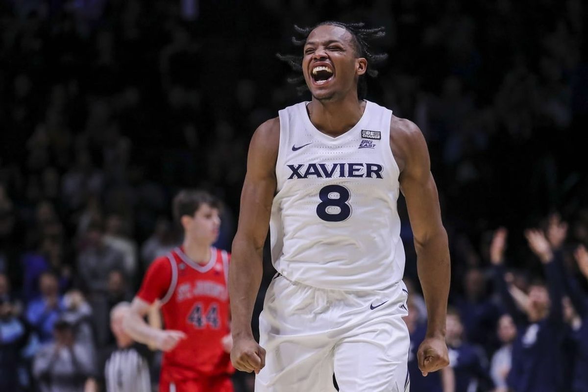 Jan 31, 2024; Cincinnati, Ohio, USA; Xavier Musketeers guard Quincy Olivari (8) reacts after making a 3-point basket against the St. John's Red Storm in the second half at Cintas Center.