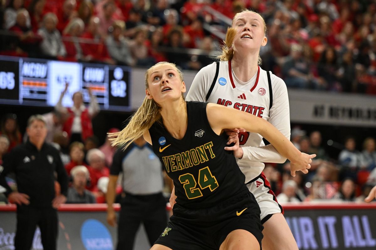Mar 22, 2025; Raleigh, North Carolina, USA; Vermont Catamounts forward Anna Olson (24) and NC State Wolfpack forward Tilda Trygger (18) position for a rebound during the second half at James T. Valvano Arena at William Neal Reynolds. Mandatory Credit: William Howard-Imagn Images