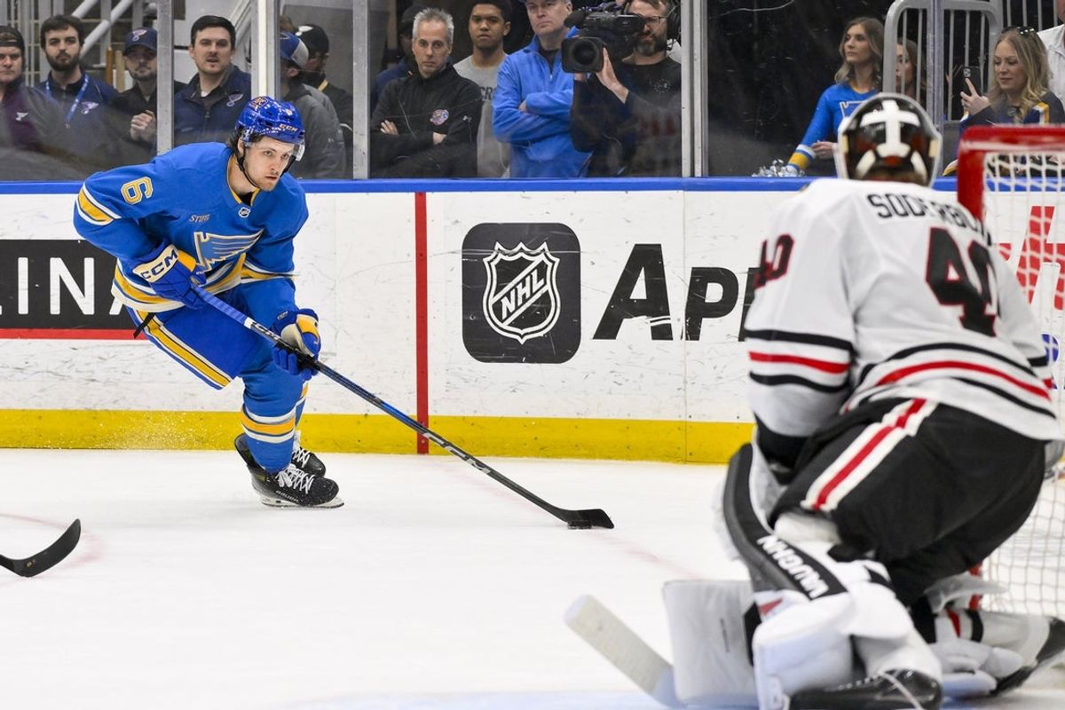 Mar 22, 2025; St. Louis, Missouri, USA;  St. Louis Blues defenseman Philip Broberg (6) controls the puck against the Chicago Blackhawks during the second period at Enterprise Center. Mandatory Credit: Jeff Curry-Imagn Images