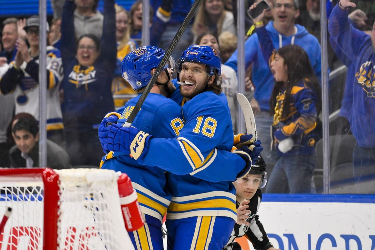 Mar 22, 2025; St. Louis, Missouri, USA;  St. Louis Blues center Robert Thomas (18) celebrates with center Dylan Holloway (81) after scoring against the Chicago Blackhawks during the second period at Enterprise Center. Mandatory Credit: Jeff Curry-Imagn Images
