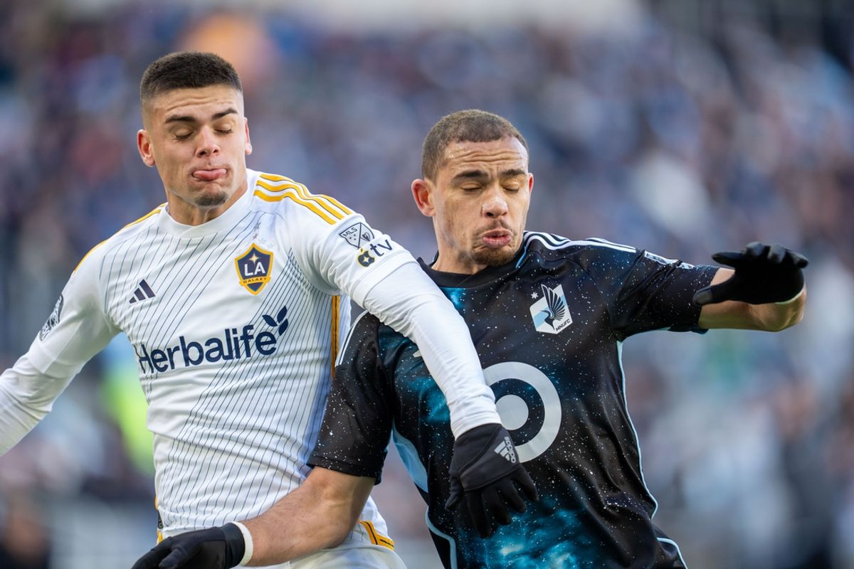 Mar 22, 2025; Saint Paul, Minnesota, USA; Los Angeles Galaxy forward Gabriel Pec (11) and Minnesota United midfielder Hassani Dotson (31) collide playing a loose ball in the first half at Allianz Field. Mandatory Credit: Matt Blewett-Imagn Images