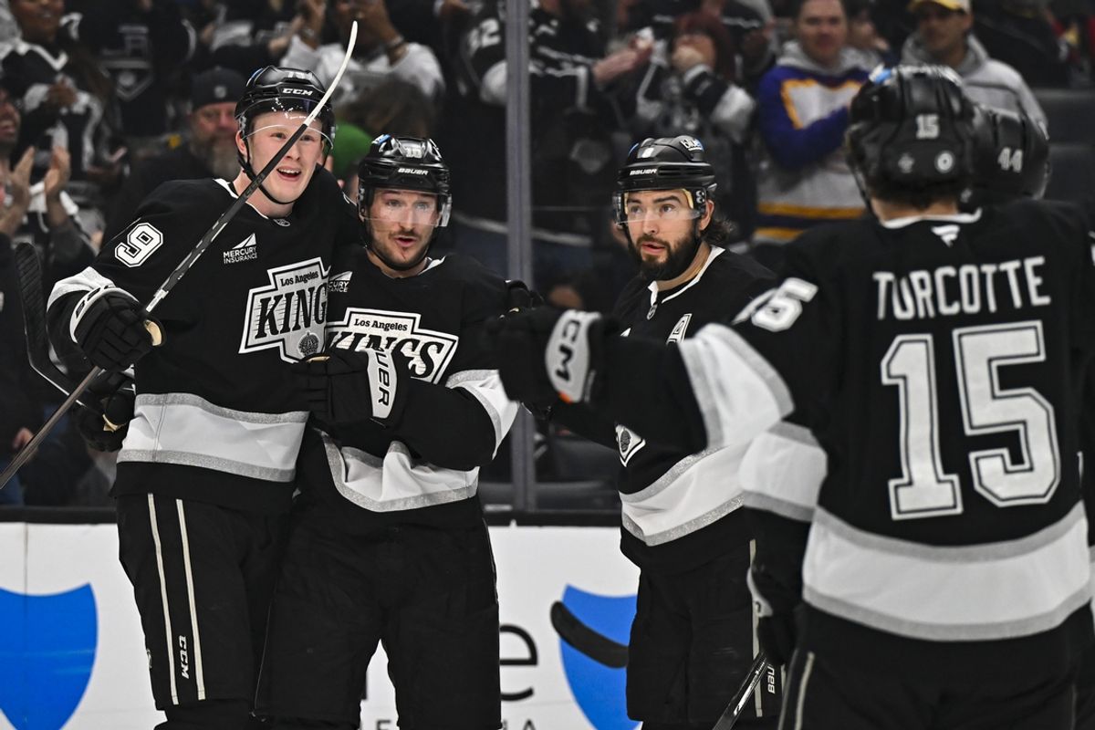 Mar 22, 2025; Los Angeles, California, USA; Los Angeles Kings defenseman Brandt Clarke (92), left wing Trevor Moore (12), and defenseman Drew Doughty (8) celebrate after scoring against the Carolina Hurricanes during the second period at Crypto.com Arena. Mandatory Credit: Jonathan Hui-Imagn Images