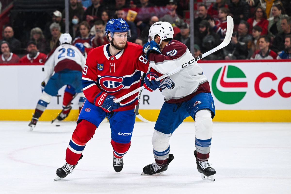 Mar 22, 2025; Montreal, Quebec, CAN; Montreal Canadiens right wing Joshua Roy (89) battles for position against Colorado Avalanche defenseman Sam Malinski (70) in the first period at Bell Centre. Mandatory Credit: David Kirouac-Imagn Images