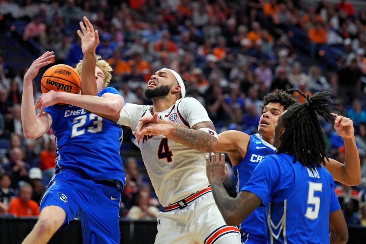 Mar 22, 2025; Lexington, KY, USA;  Creighton Bluejays forward Jackson McAndrew (23) and Auburn Tigers forward Johni Broome (4) go for a rebound during the second half in the second round to the NCAA Tournament at Rupp Arena. Mandatory Credit: Aaron Doster-Imagn Images
