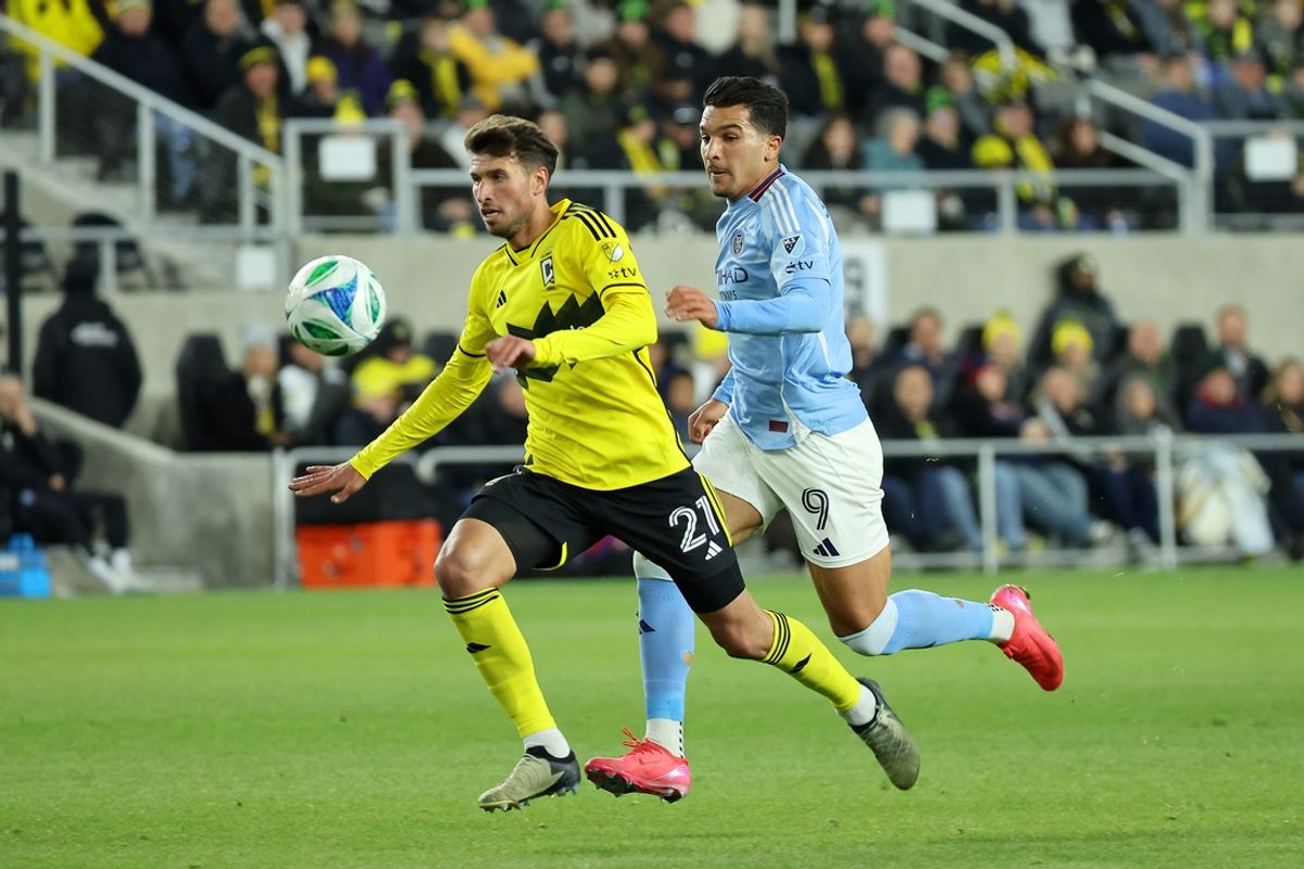 Mar 22, 2025; Columbus, Ohio, USA;  Columbus Crew defender Yevhen Cheberko (21) chases the ball as New York City forward Monsef Bakrar (9) defends during the first half at Lower.com Field. Mandatory Credit: Joseph Maiorana-Imagn Images