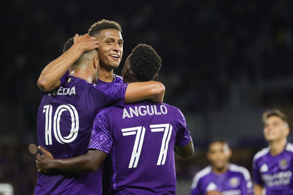Mar 22, 2025; Orlando, Florida, USA; Orlando City midfielder Martin Ojeda (10) celebrates with defender Rafael Santos (3) and forward Ivan Angulo (77) after scoring a goal against D.C. United in the first half at Inter&Co Stadium. Mandatory Credit: Nathan Ray Seebeck-Imagn Images