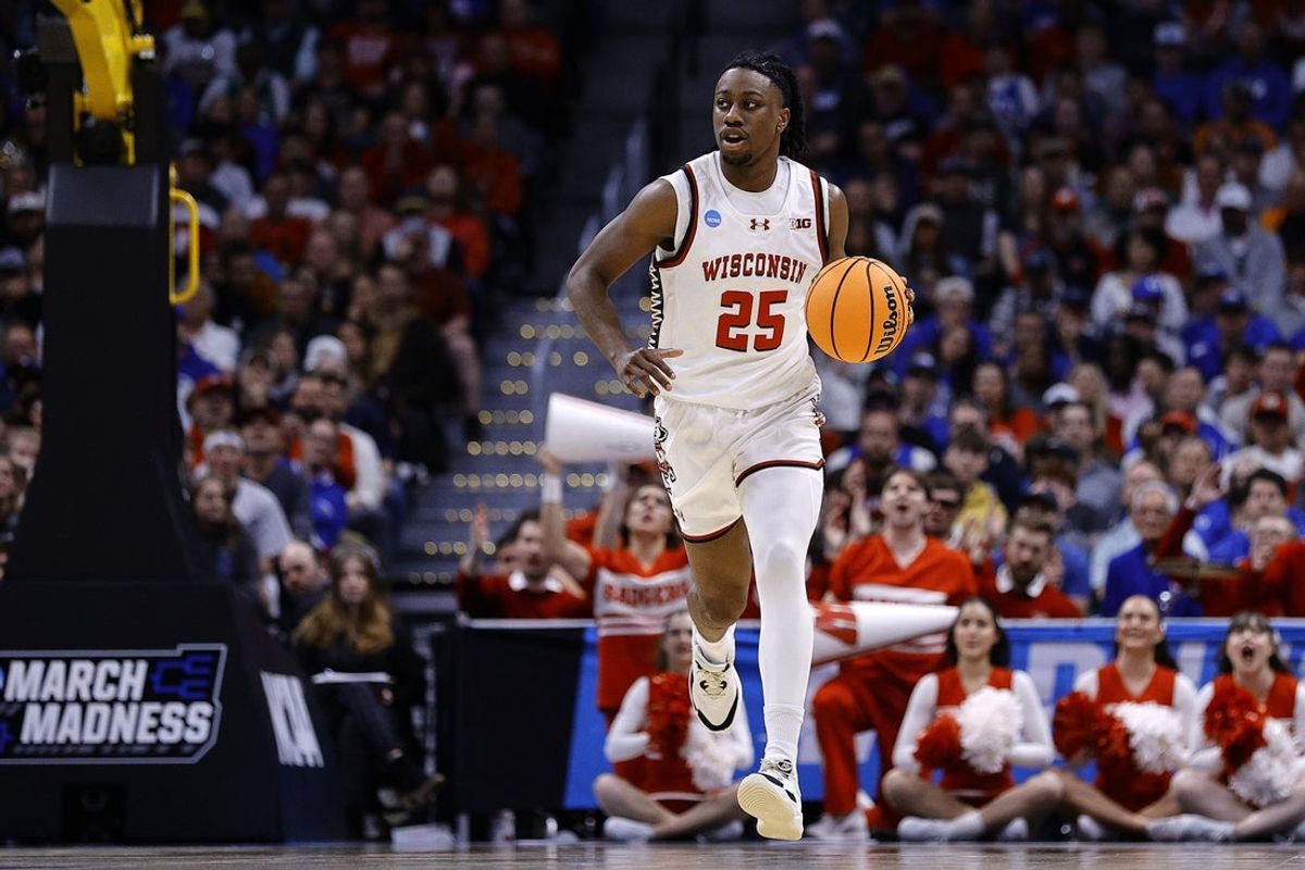 Mar 22, 2025; Denver, CO, USA; Wisconsin Badgers guard John Blackwell (25) dribbles the ball against the Brigham Young Cougars during the first half in the second round of the NCAA Tournament  at Ball Arena. Mandatory Credit: Isaiah J. Downing-Imagn Images