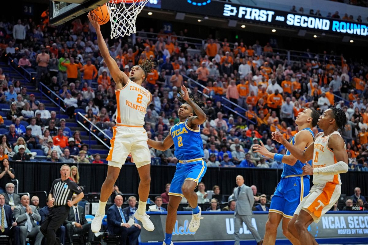Mar 22, 2025; Lexington, KY, USA; Tennessee Volunteers guard Chaz Lanier (2) shoots the ball agents UCLA Bruins guard Dylan Andrews (2) during the first half in the second round of the NCAA Tournament at Rupp Arena. Mandatory Credit: Aaron Doster-Imagn Images