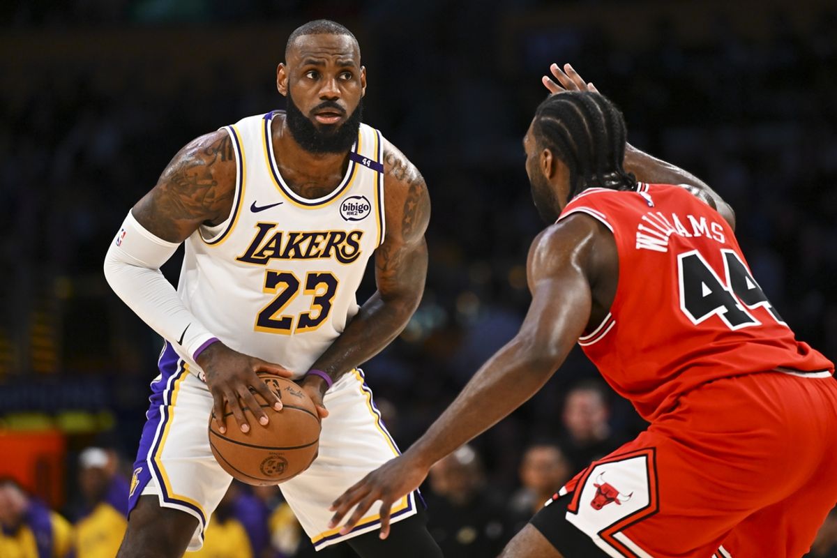 Mar 22, 2025; Los Angeles, California, USA; Los Angeles Lakers forward LeBron James (23) looks to pass against Chicago Bulls forward Patrick Williams (44) during the first half at Crypto.com Arena. Mandatory Credit: Jonathan Hui-Imagn Images