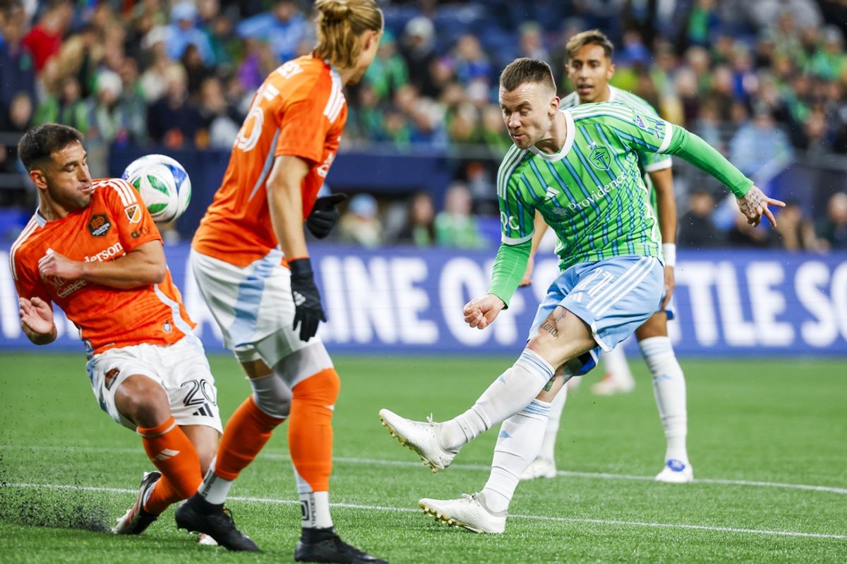 Mar 22, 2025; Seattle, Washington, USA; Houston Dynamo FC midfielder Nicolas Lodeiro (20) blocks a shot attempt by Seattle Sounders FC midfielder Albert Rusnak (11) during the first half at Lumen Field. Mandatory Credit: Joe Nicholson-Imagn Images