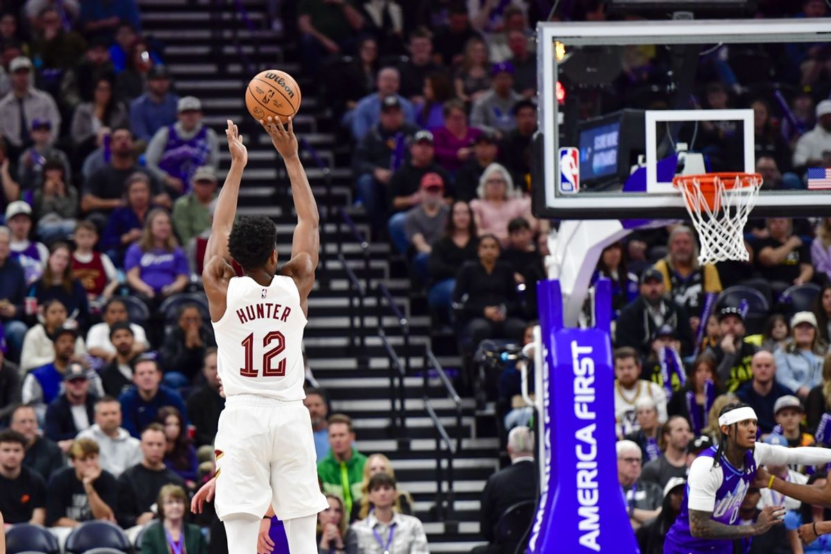 Mar 23, 2025; Salt Lake City, Utah, USA; Cleveland Cavaliers forward/guard De'Andre Hunter (12) makes three point attempt against the Utah Jazz during the first half at Delta Center. Mandatory Credit: Peter Creveling-Imagn Images