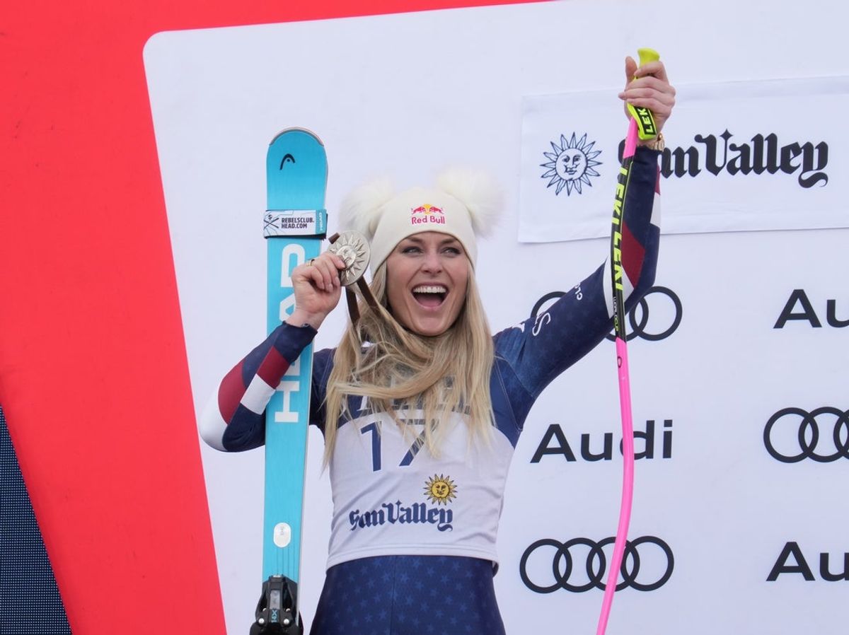 Mar 23, 2025; Sun Valley, ID, USA; Lindsey Vonn of the United States celebrates on the podium after placing second in the Super G alpine skiing race in the 2025 FIS Ski World Cup at Sun Valley. Mandatory Credit: Michael Madrid-Imagn Images