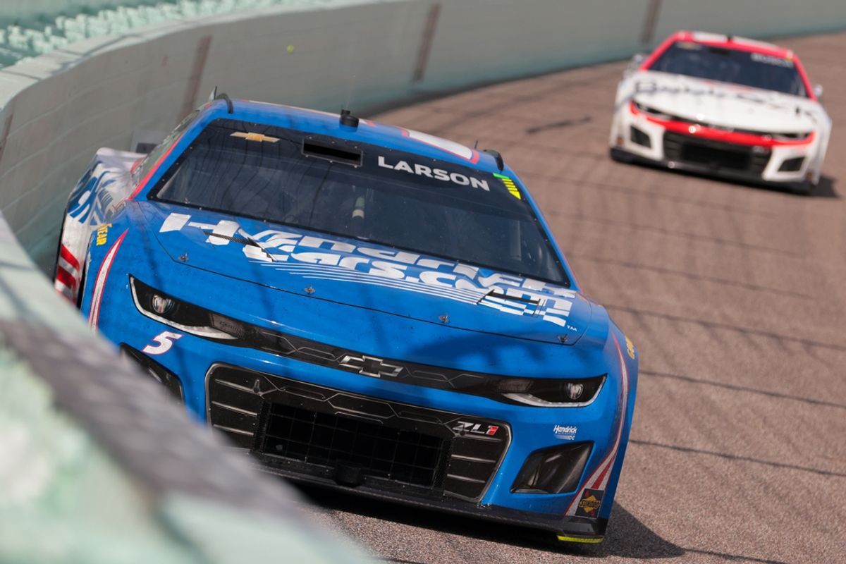 Mar 23, 2025; Homestead, Florida, USA; NASCAR Cup Series driver Kyle Larson (5) races during the Straight Talk Wireless 400 at Homestead-Miami Speedway. Mandatory Credit: Sam Navarro-Imagn Images