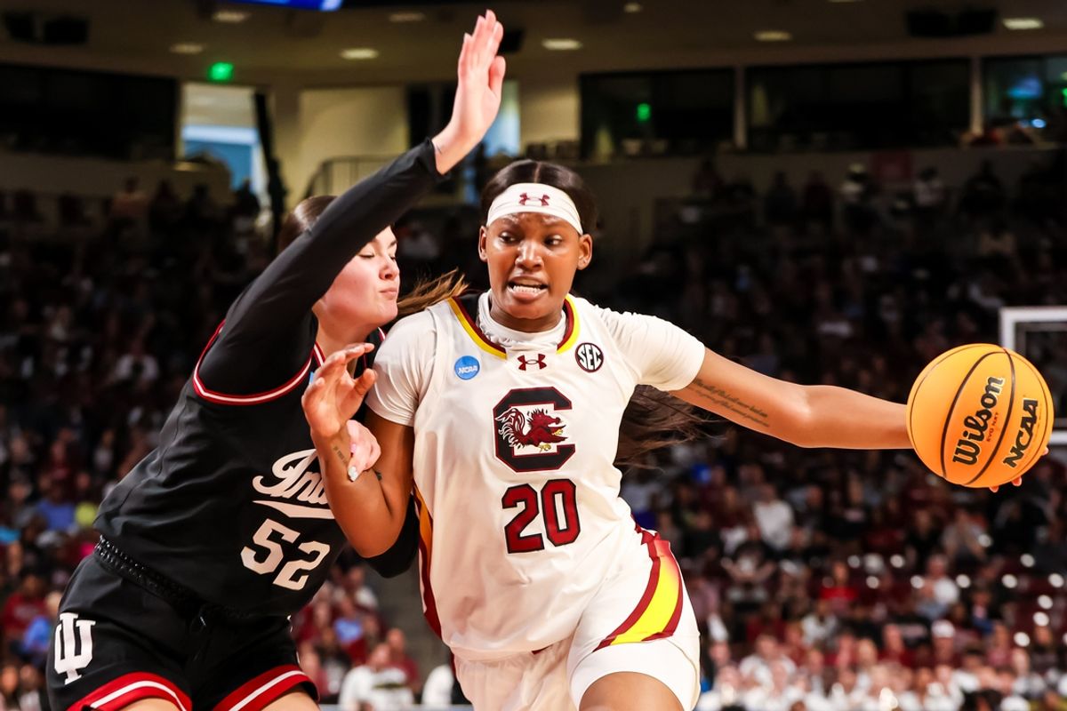 Mar 23, 2025; Columbia, South Carolina, USA; South Carolina Gamecocks forward Sania Feagin (20) drives around Indiana Hoosiers forward Lilly Meister (52) in the first half at Colonial Life Arena. Mandatory Credit: Jeff Blake-Imagn Images