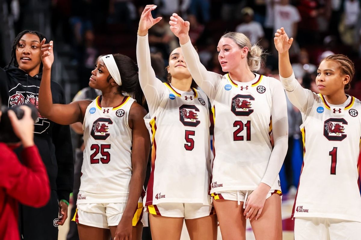 Mar 23, 2025; Columbia, South Carolina, USA;  South Carolina Gamecocks forward Ashlyn Watkins (2), guard Raven Johnson (25), guard Tessa Johnson (5), forward Chloe Kitts (21) and guard Maddy McDaniel (1) celebrate following their win against the Indiana Hoosiers at Colonial Life Arena. Mandatory Credit: Jeff Blake-Imagn Images