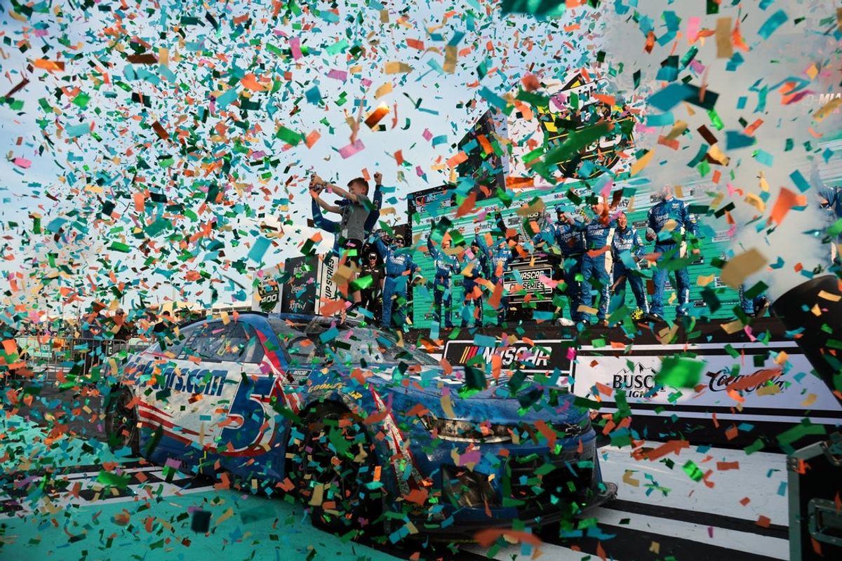 Mar 23, 2025; Homestead, Florida, USA; NASCAR Cup Series driver Kyle Larson (5) celebrates with his son after winning the Straight Talk Wireless 400 at Homestead-Miami Speedway. Mandatory Credit: Sam Navarro-Imagn Images