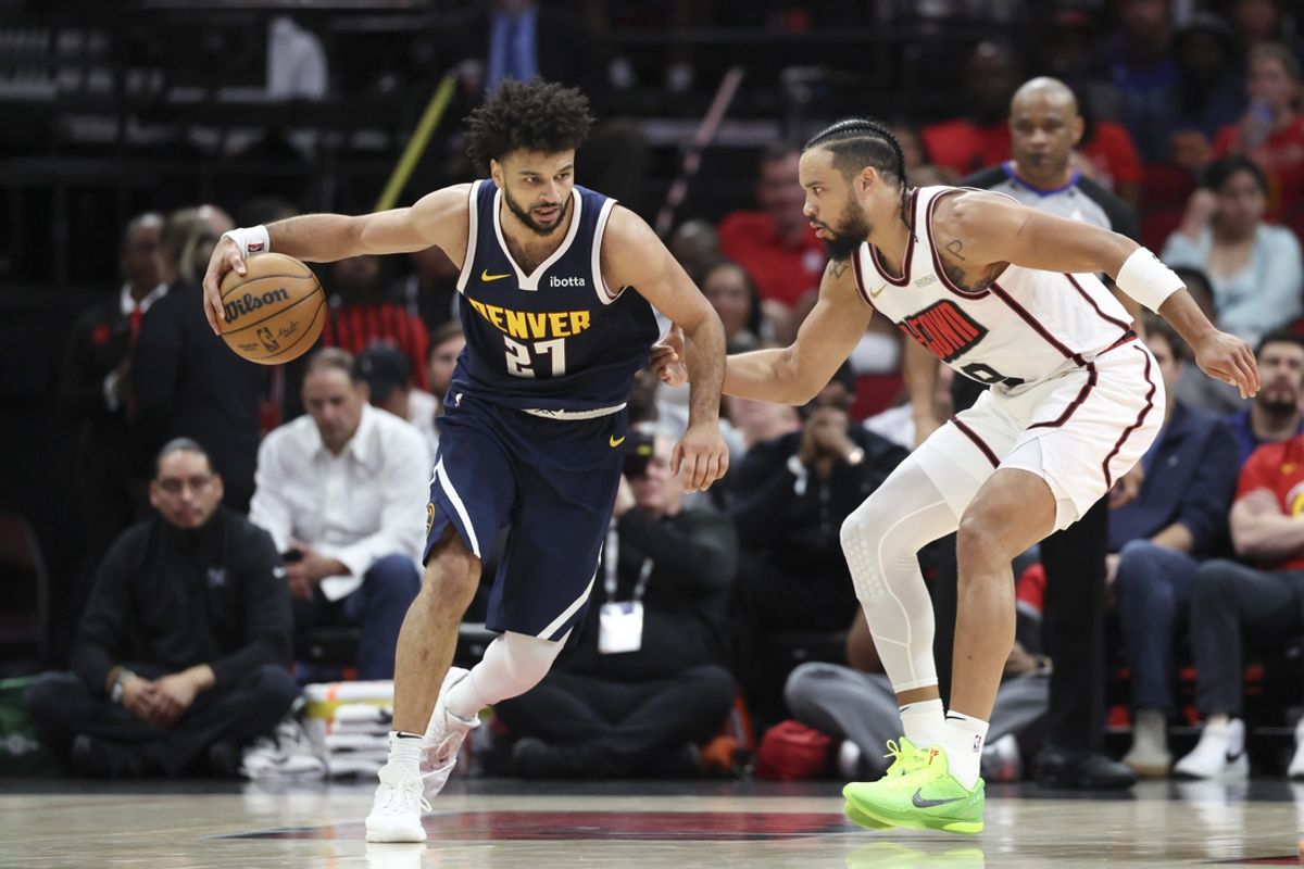 Mar 23, 2025; Houston, Texas, USA; Denver Nuggets guard Jamal Murray (27) controls the ball as Houston Rockets forward Dillon Brooks (9) defends during the second quarter at Toyota Center. Mandatory Credit: Troy Taormina-Imagn Images