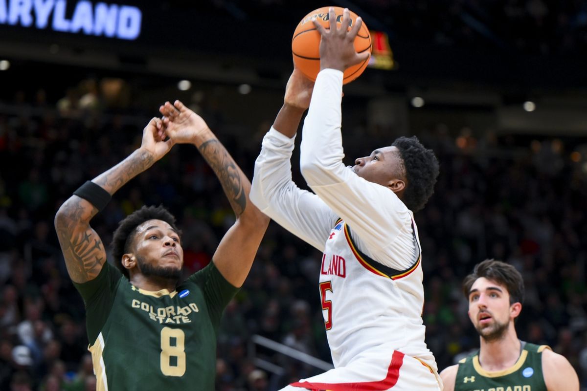 Mar 23, 2025; Seattle, WA, USA; Maryland Terrapins center Derik Queen (25) drives to the basket against Colorado State Rams forward Jaylen Crocker-Johnson (8) in the first half at Climate Pledge Arena. Mandatory Credit: Steven Bisig-Imagn Images