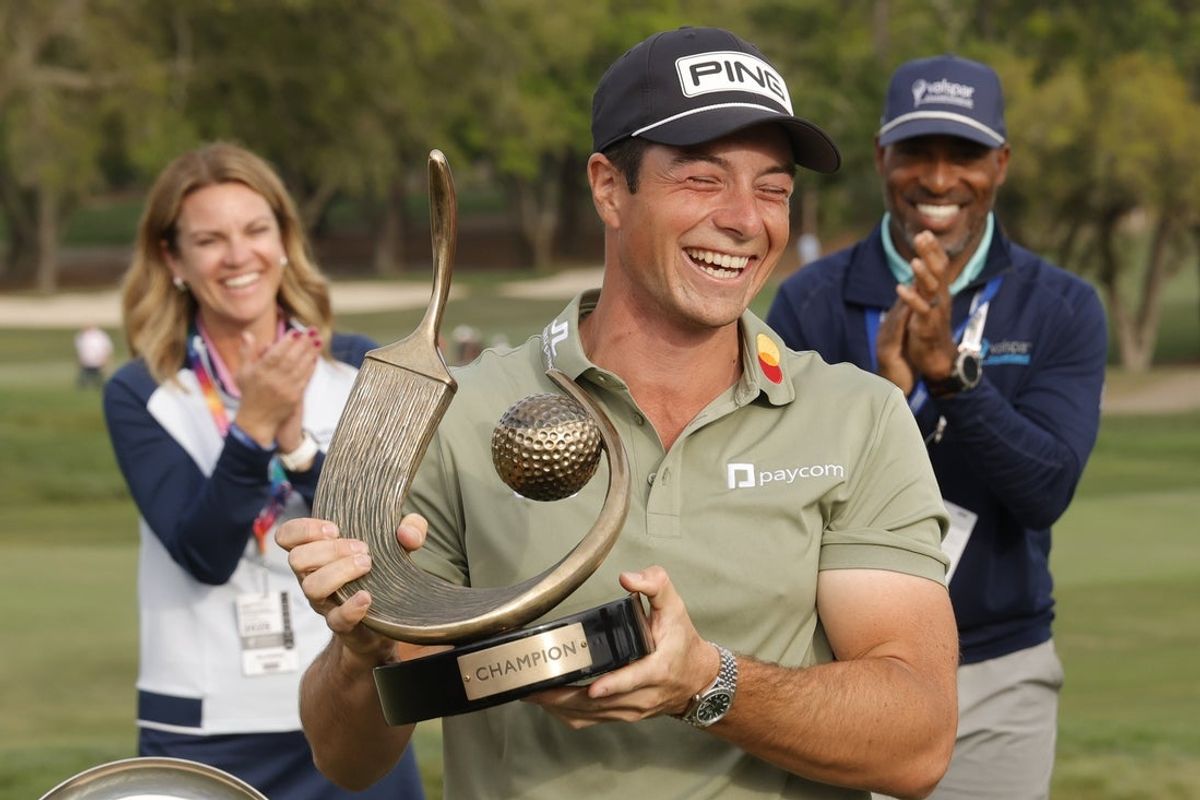 Mar 23, 2025; Palm Harbor, Florida, USA;  Viktor Hovland holds the champions trophy after winning the Valspar Championship golf tournament at Innisbrook Resort. Mandatory Credit: Reinhold Matay-Imagn Images