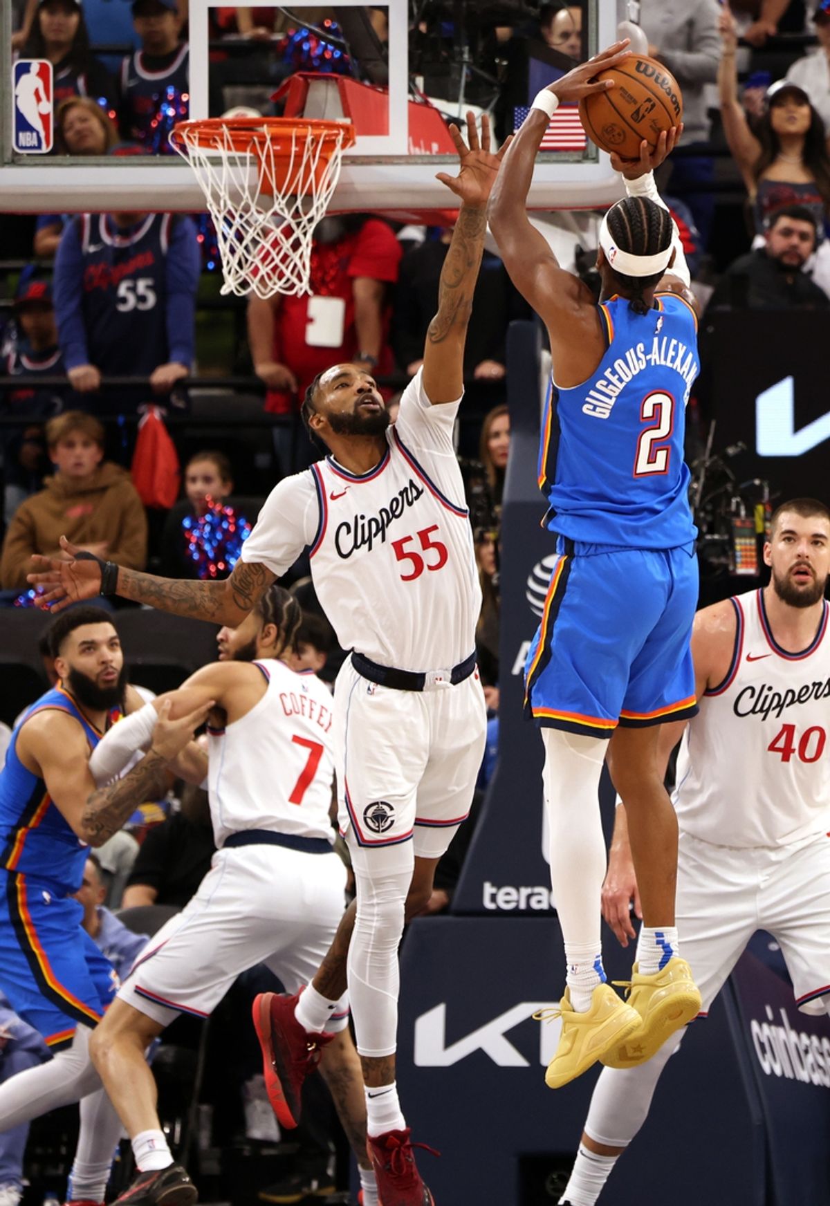 Mar 23, 2025; Inglewood, California, USA; Oklahoma City Thunder guard Shai Gilgeous-Alexander (2) shoots against LA Clippers forward Derrick Jones Jr. (55) during the 2nd quarter at Intuit Dome. Mandatory Credit: Jason Parkhurst-Imagn Images