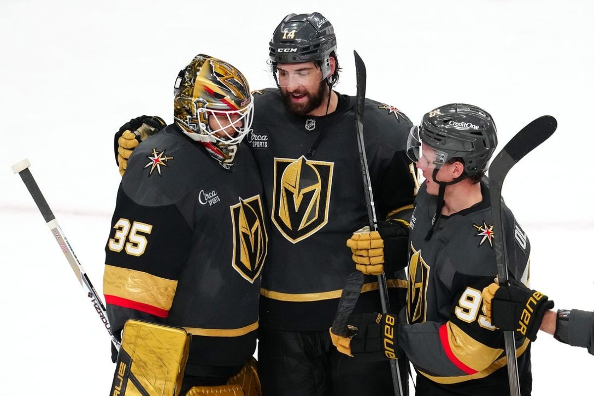 Mar 23, 2025; Las Vegas, Nevada, USA; Vegas Golden Knights goaltender Ilya Samsonov (35) is congratulated by defenseman Nicolas Hague (14) and  right wing Victor Olofsson (95) after defeating the Tampa Bay Lightning 4-2 at T-Mobile Arena. Mandatory Credit: Stephen R. Sylvanie-Imagn Images