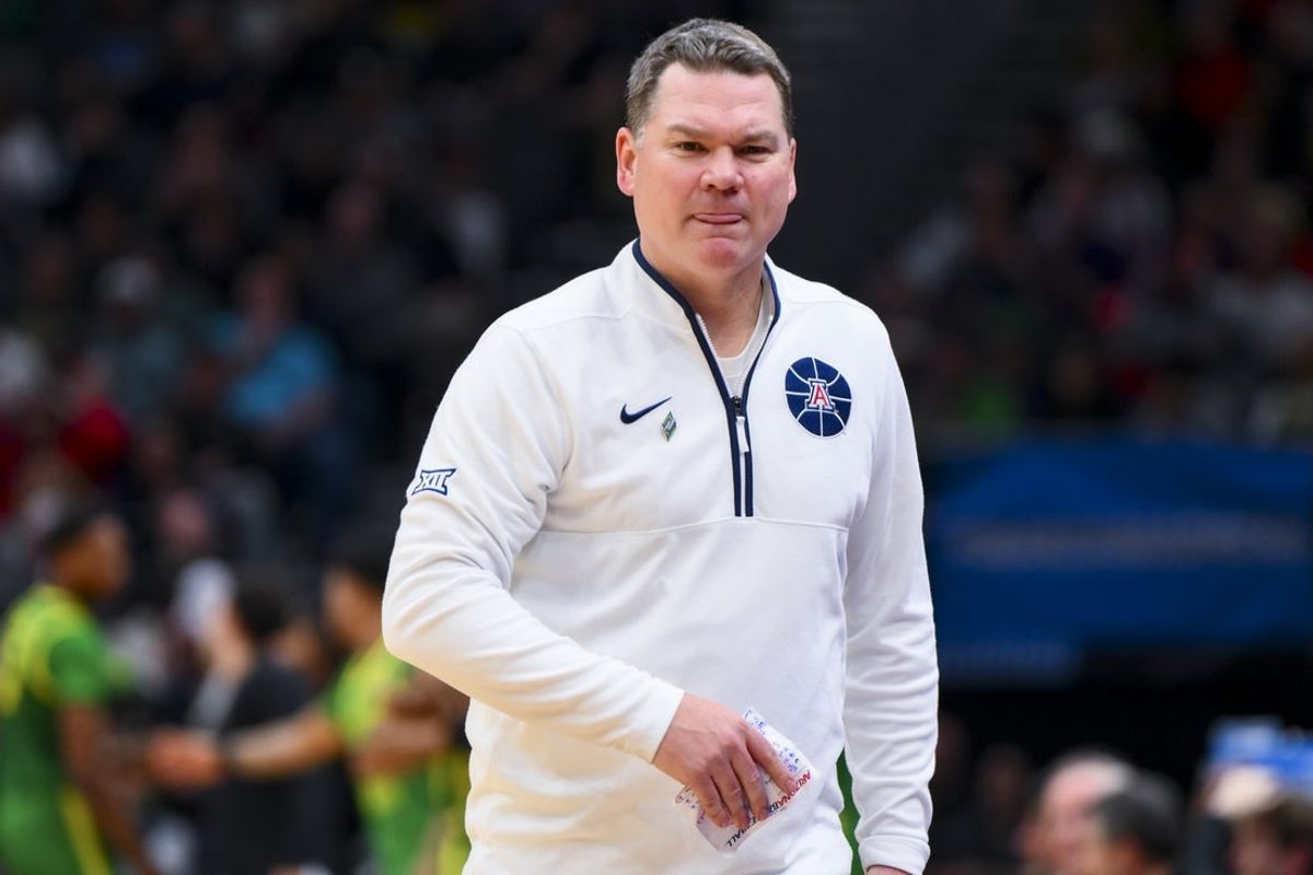 Mar 23, 2025; Seattle, WA, USA;  Arizona Wildcats head coach Tommy Lloyd works the sideline against the Oregon Ducks in the second half at Climate Pledge Arena. Mandatory Credit: Steven Bisig-Imagn Images
