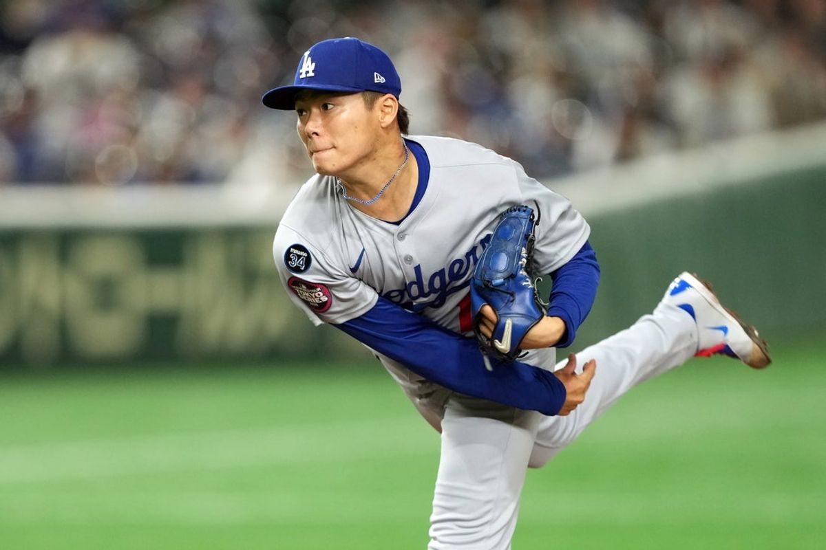 Mar 18, 2025; Bunkyo, Tokyo, JPN; Los Angeles Dodgers starting pitcher Yoshinobu Yamamoto (18) throws a pitch against the Chicago Cubs during the first inning during the Tokyo Series at Tokyo Dome. Mandatory Credit: Darren Yamashita-Imagn Images