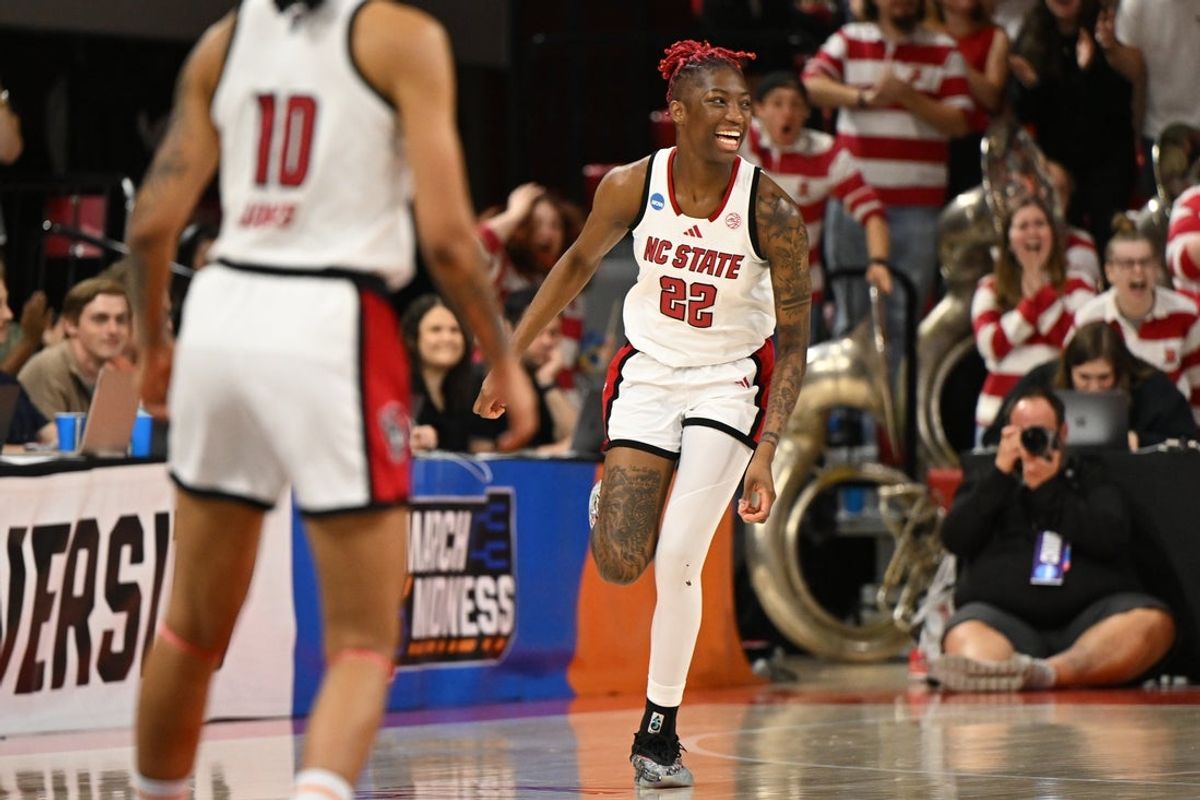 Mar 24, 2025; Raleigh, North Carolina, USA; NC State Wolfpack guard Saniya Rivers (22) celebrates after a score during the second half at James T. Valvano Arena at William Neal Reynolds. Mandatory Credit: William Howard-Imagn Images