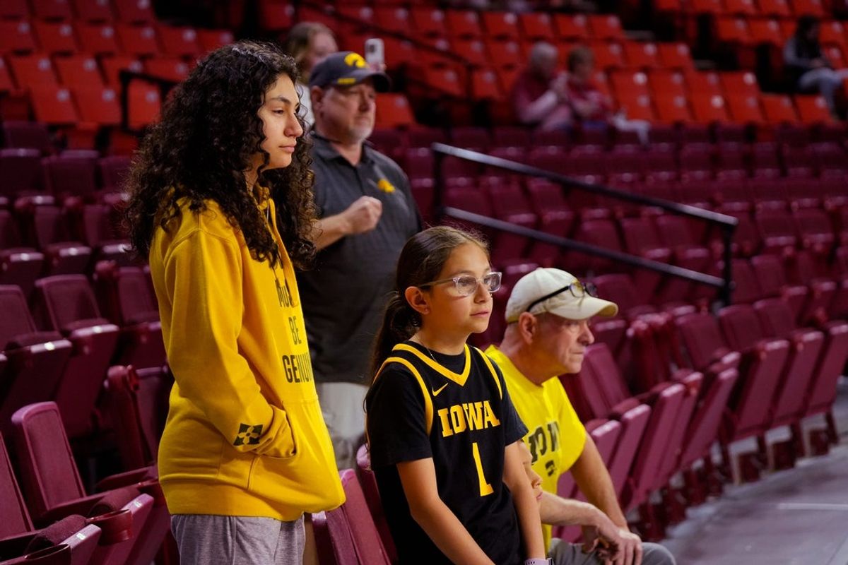 Iowa fans watch the pre game warm ups during the second round of the NCAA March Madness Women's college basketball game between University of Oklahoma Sooners and Iowa Hawkeyes at the Lloyd Noble Center in Norman, Okla., Monday, March 24, 2025.