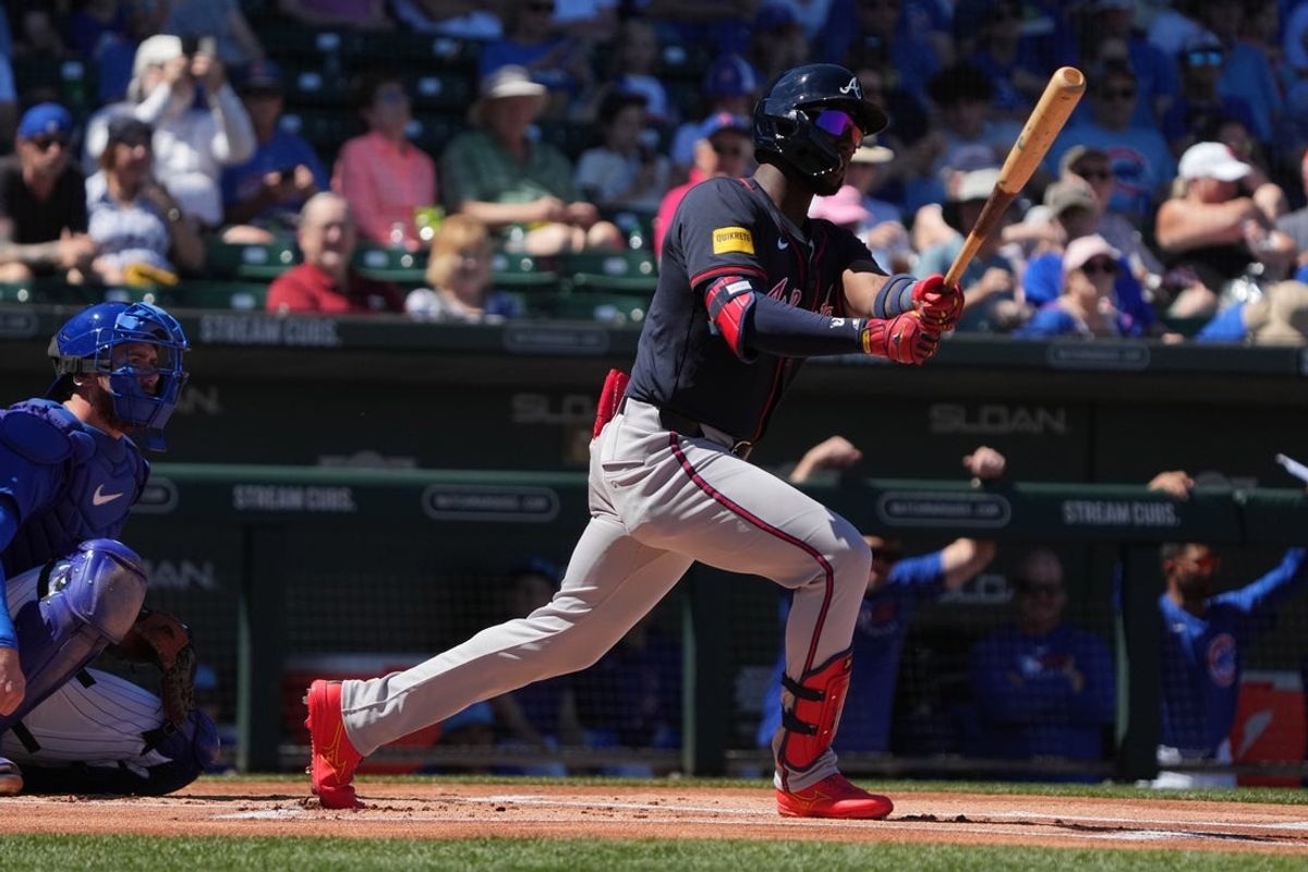 Mar 24, 2025; Mesa, Arizona, USA; Atlanta Braves outfielder Jurickson Profar (7) hits against the Chicago Cubs in the first inning at Sloan Park. Mandatory Credit: Rick Scuteri-Imagn Images