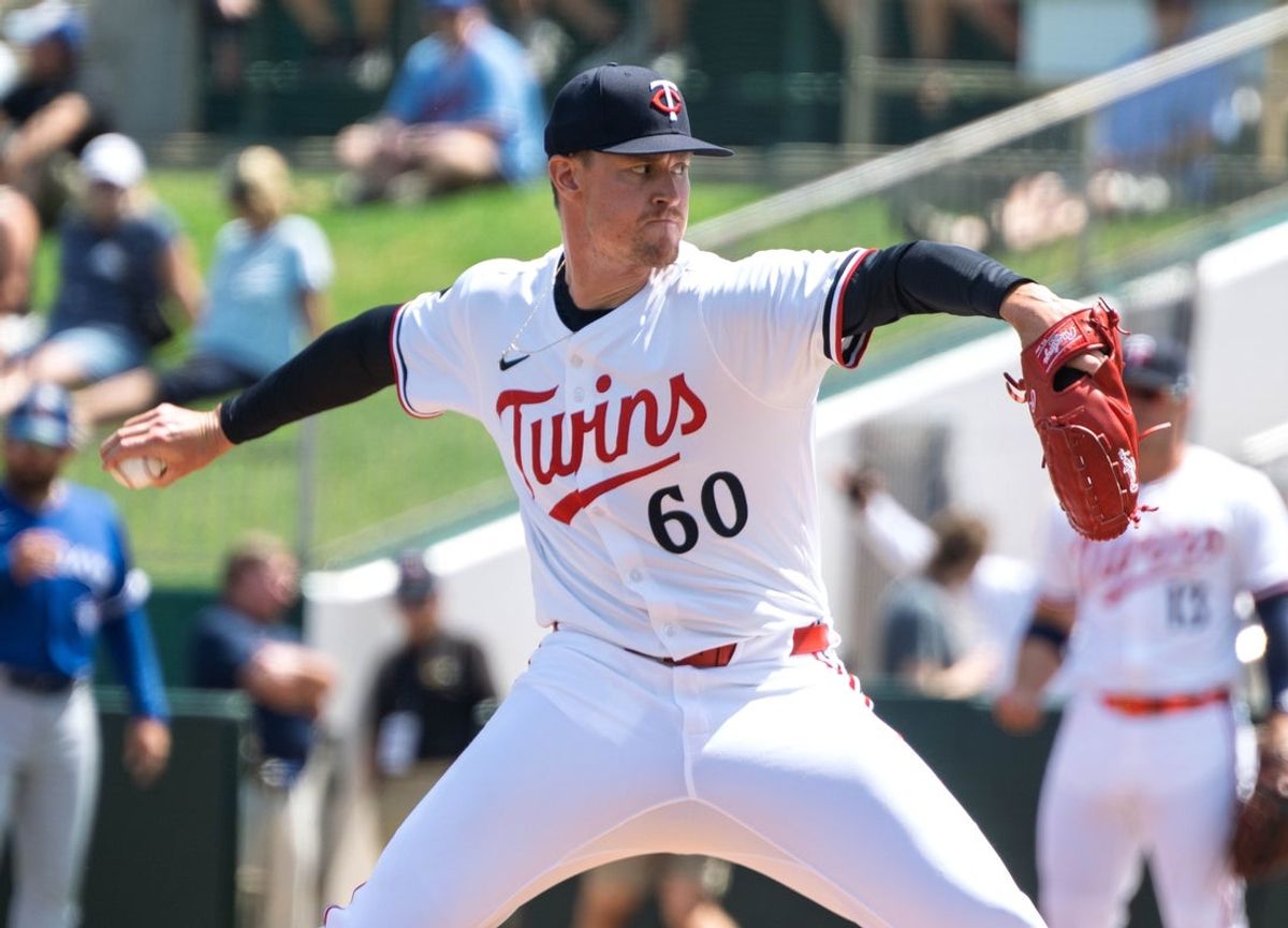 Mar 22, 2025; Fort Myers, Florida, USA; Minnesota Twins Scott Blewett (60) pitching during the first inning of their game against the Toronto Blue Jays at Lee Health Sports Complex. Mandatory Credit: Chris Tilley-Imagn Images