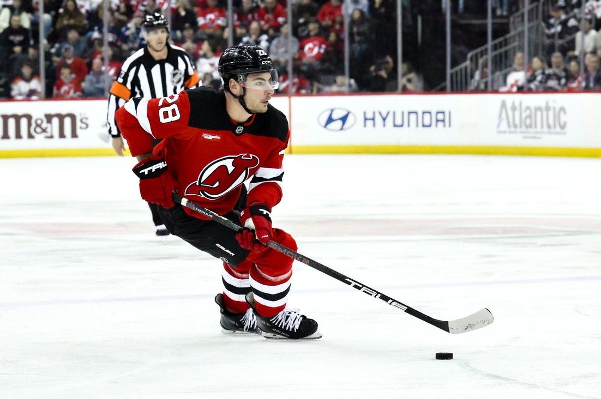 Mar 24, 2025; Newark, New Jersey, USA; New Jersey Devils right wing Timo Meier (28) skates with the puck during the second period against the Vancouver Canucks at Prudential Center. Mandatory Credit: John Jones-Imagn Images