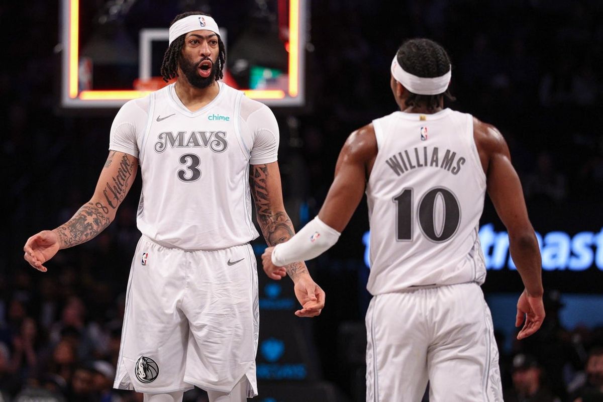 Mar 24, 2025; Brooklyn, New York, USA; Dallas Mavericks forward Anthony Davis (3) celebrates with Dallas Mavericks guard Brandon Williams (10) after basket during the second half against the Brooklyn Nets at Barclays Center. Mandatory Credit: Vincent Carchietta-Imagn Images