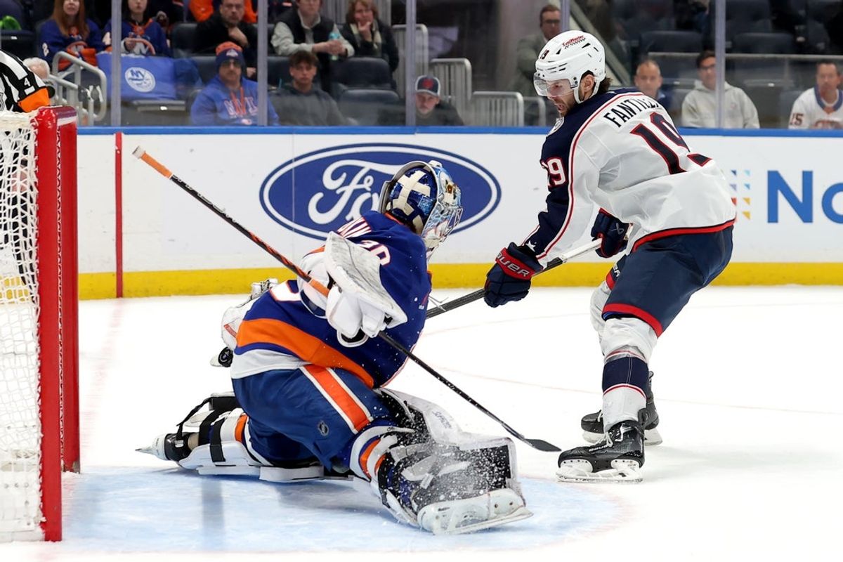 Mar 24, 2025; Elmont, New York, USA; Columbus Blue Jackets center Adam Fantilli (19) scores a goal past New York Islanders goaltender Ilya Sorokin (30) during the shootout at UBS Arena. Mandatory Credit: Brad Penner-Imagn Images