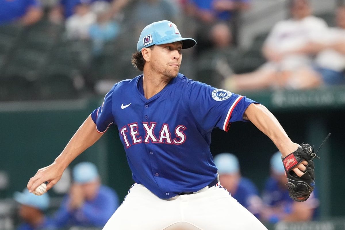 Mar 25, 2025; Arlington, Texas, USA; Texas Rangers starting pitcher Jacob deGrom (48) delivers a pitch to the Kansas City Royals in the third inning at Globe Life Field. Mandatory Credit: Jim Cowsert-Imagn Images