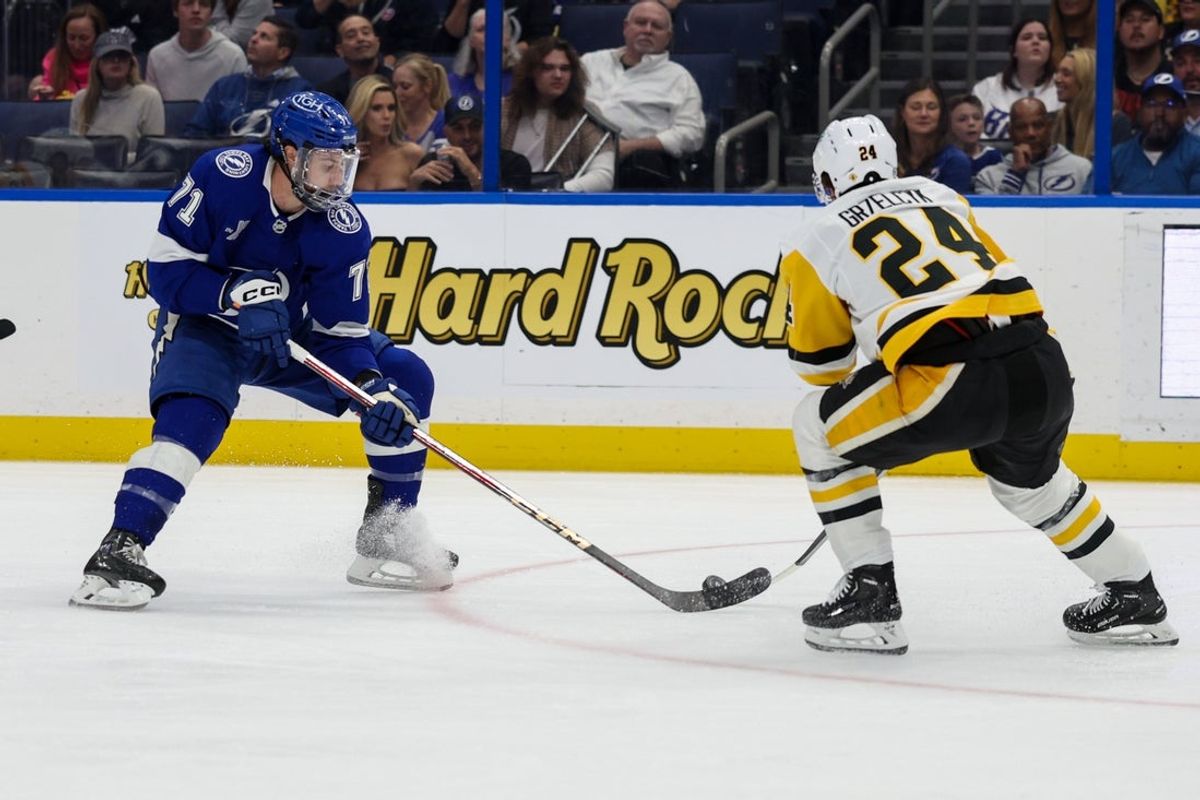 Mar 25, 2025; Tampa, Florida, USA; Tampa Bay Lightning center Anthony Cirelli (71) controls the puck against the Pittsburgh Penguins in the first period at Amalie Arena. Mandatory Credit: Nathan Ray Seebeck-Imagn Images
