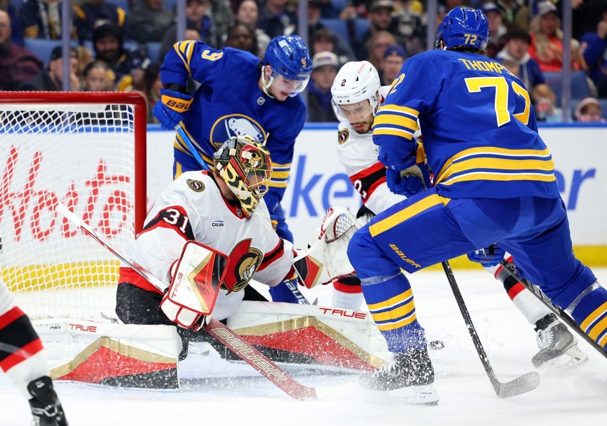 Mar 25, 2025; Buffalo, New York, USA;  Ottawa Senators goaltender Anton Forsberg (31) makes a save on Buffalo Sabres center Tage Thompson (72) during the second period at KeyBank Center. Mandatory Credit: Timothy T. Ludwig-Imagn Images