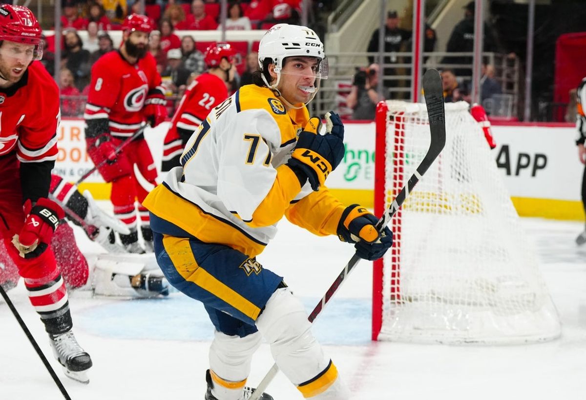 Mar 25, 2025; Raleigh, North Carolina, USA;  Nashville Predators right wing Luke Evangelista (77) celebrates his goal against the Carolina Hurricanes during the second period at Lenovo Center. Mandatory Credit: James Guillory-Imagn Images