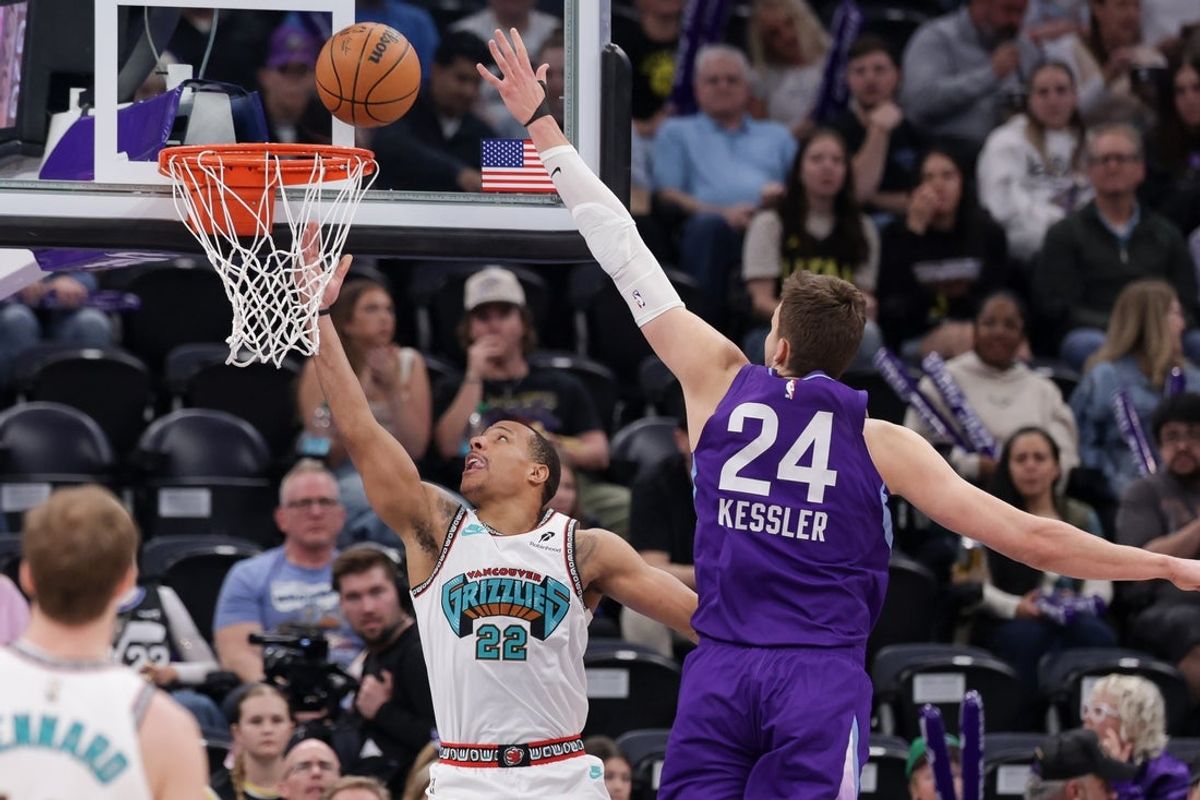 Mar 25, 2025; Salt Lake City, Utah, USA;  Memphis Grizzlies guard Desmond Bane (22) gets past Utah Jazz center Walker Kessler (24) and to the basket during the first quarter at Delta Center. Mandatory Credit: Chris Nicoll-Imagn Images