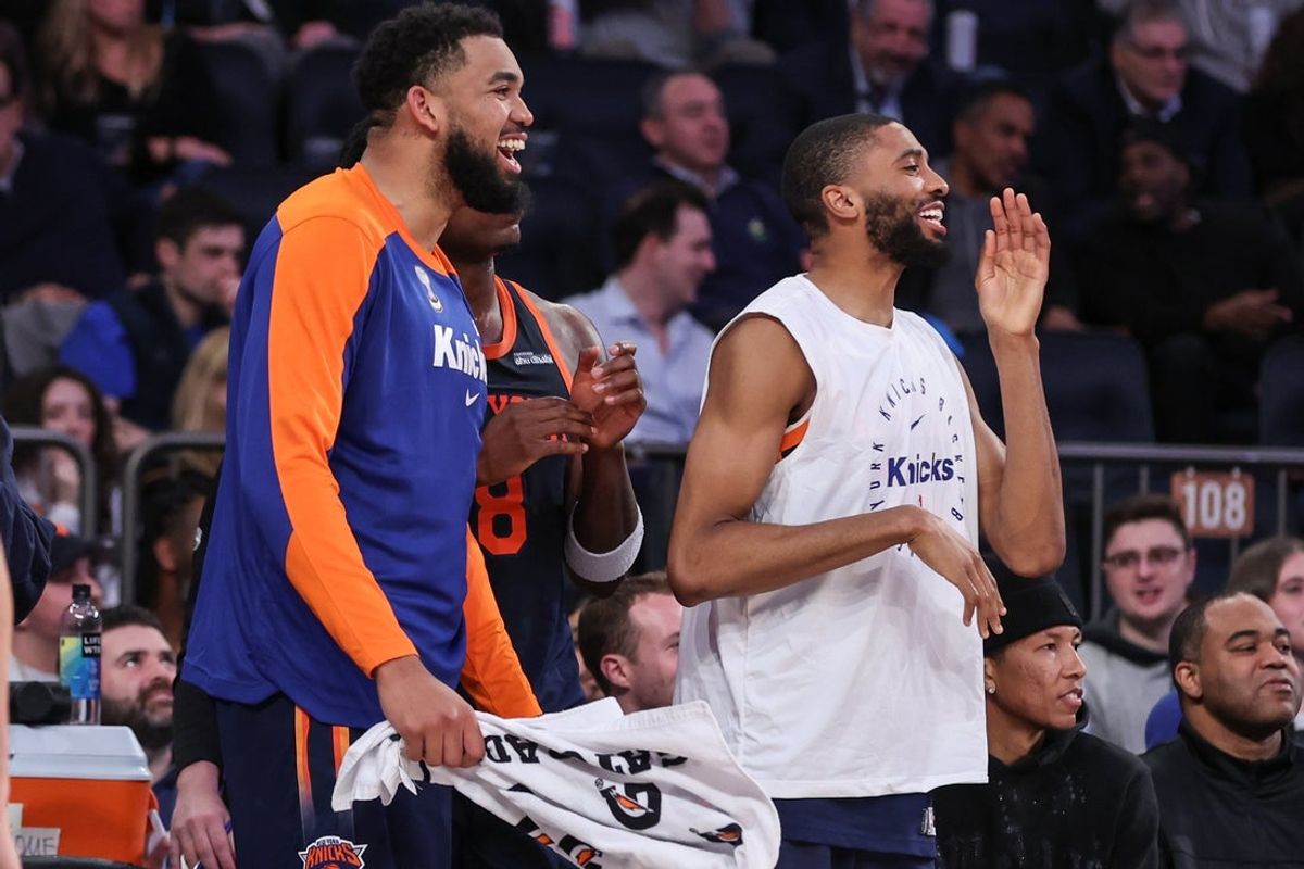 Mar 25, 2025; New York, New York, USA;  New York Knicks center Karl-Anthony Towns (32) and forward Mikal Bridges (25) celebrate during the closing seconds of the fourth quarter against the Dallas Mavericks at Madison Square Garden. Mandatory Credit: Wendell Cruz-Imagn Images