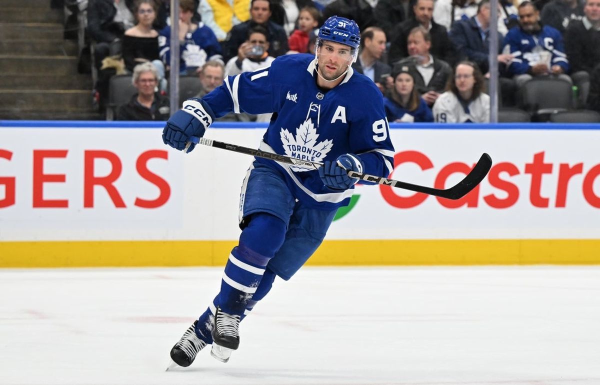 Mar 25, 2025; Toronto, Ontario, CAN;  Toronto Maple Leafs forward John Tavares (91) skates against the Philadelphia Flyers in the third period at Scotiabank Arena. Mandatory Credit: Dan Hamilton-Imagn Images